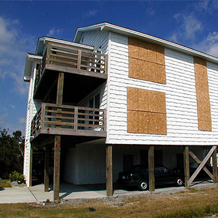Home with boarded windows