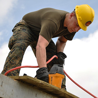 man building house